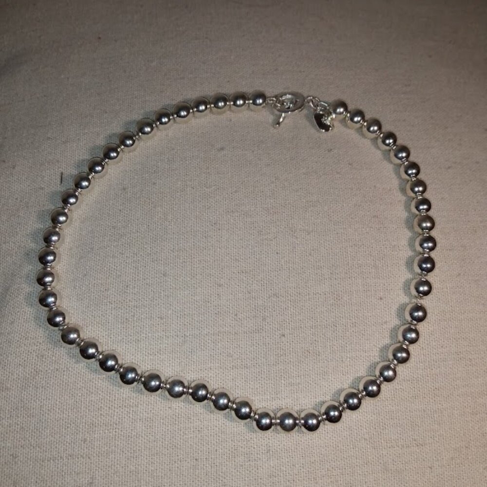 RLL: Silver tone beaded necklace.